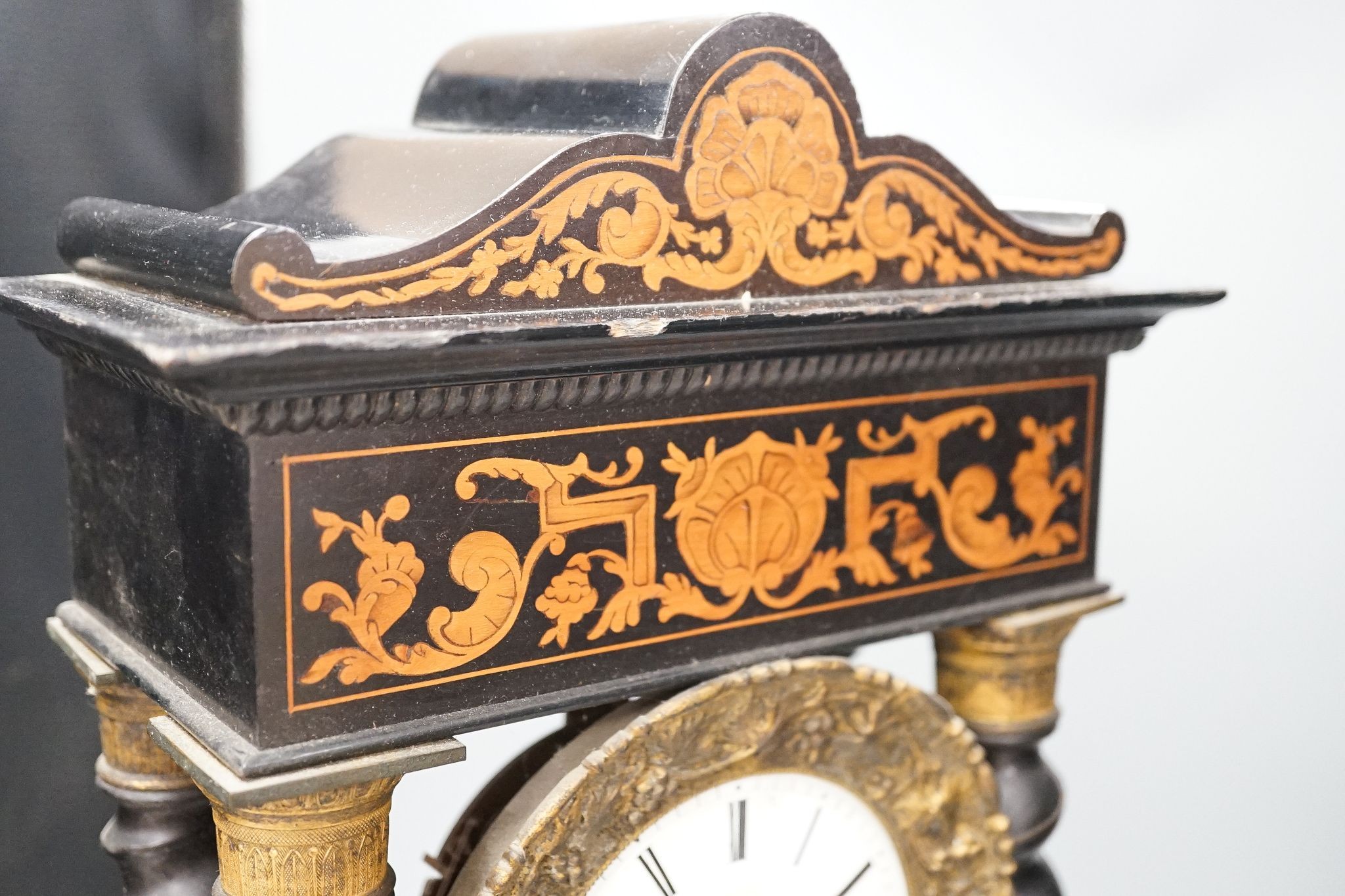 An ebonised and marquetry portico clock, dial signed Valogne, Paris, 56cm high